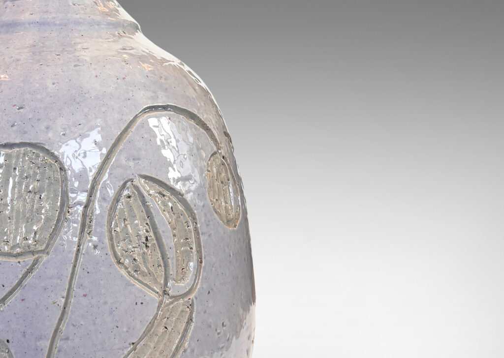 Gallery BAC ample ovoid form with sprouting neck and carved abstract floral ornaments, glazed in glossy pale gray and ivory
