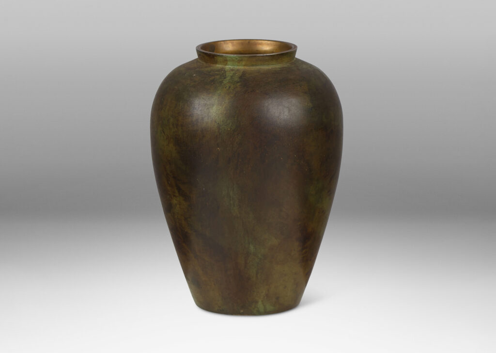 Gallery BAC tapered form with a rich verdigris-brown-black patination and contrasting polished lip; bronze