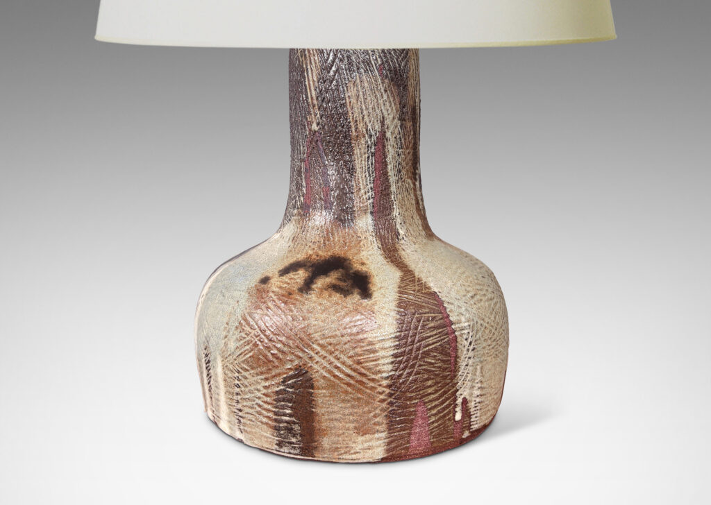 Gallery BAC low drum form and wide neck, with carved hatched texture and flowing brown and pale gray glazing