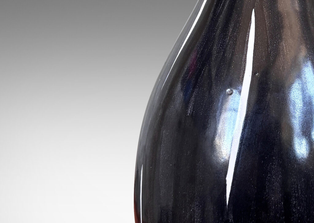 Gallery BAC organically modeled gourd form, glazed in black with white veining