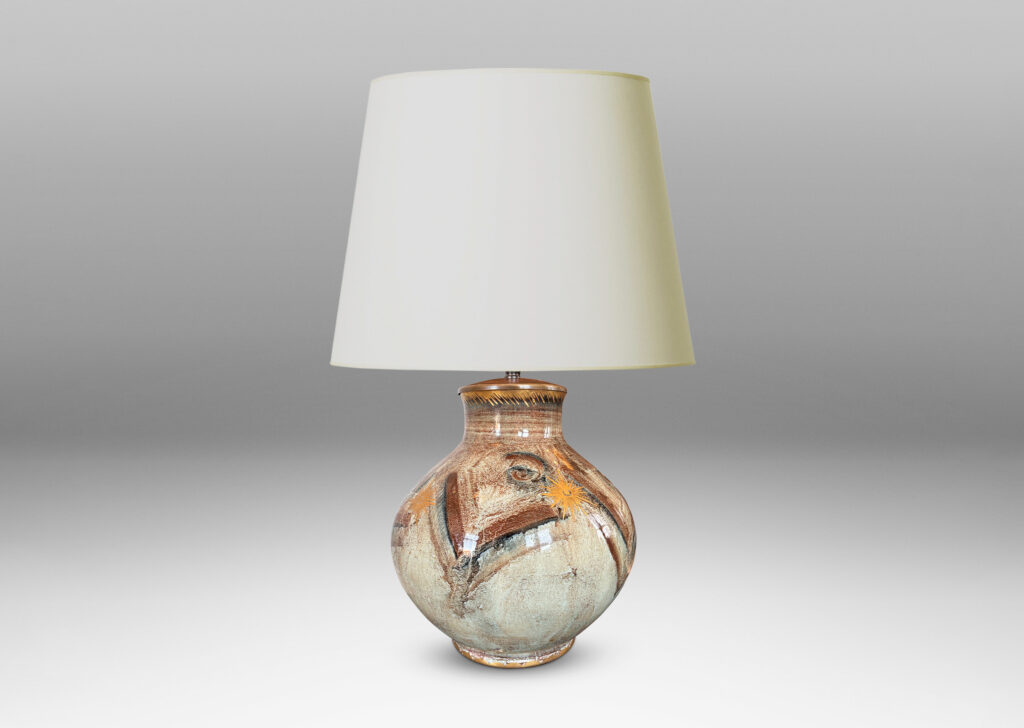 Gallery BAC plump globe form with short wide neck, glazed in pale greige, with chevron pattern in browns and blacks, and gilded star motifs and accents