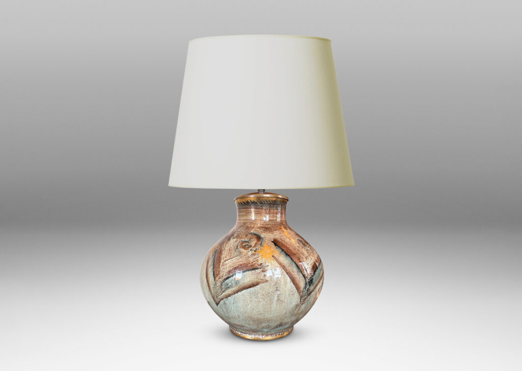 Gallery BAC plump globe form with short wide neck, glazed in pale greige, with chevron pattern in browns and blacks, and gilded star motifs and accents