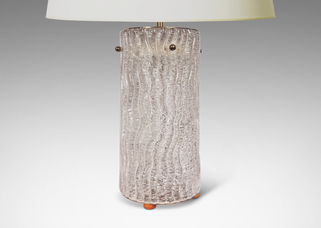 Gallery BAC cylindrical form comprised of glass panels with a wavy relief texture mounted to a brass frame and cap