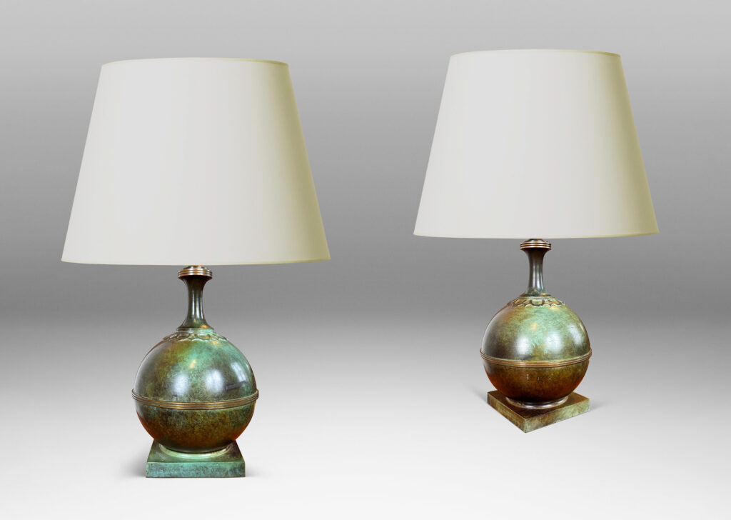 Gallery BAC globe forms on square plinths with collar ornaments and coved necks; high-quality cast bronze with a magnificent original patination featuring notable verdigris blue-green tones and burnished detailing