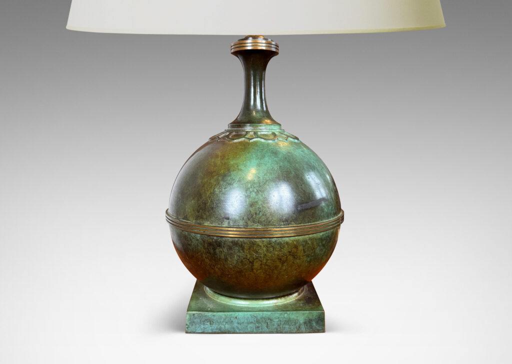 Gallery BAC globe forms on square plinths with collar ornaments and coved necks; high-quality cast bronze with a magnificent original patination featuring notable verdigris blue-green tones and burnished detailing