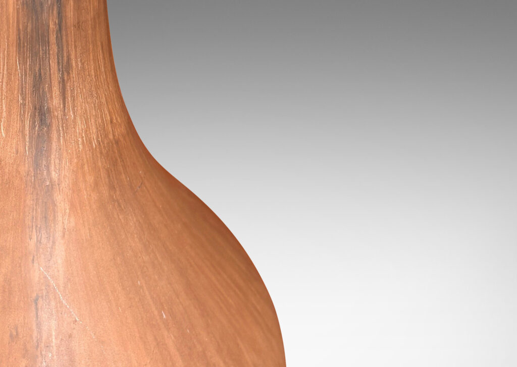 Gallery BAC organically modeled bulbous form with a tall attenuated neck, glazed in a matte sandy brown tones