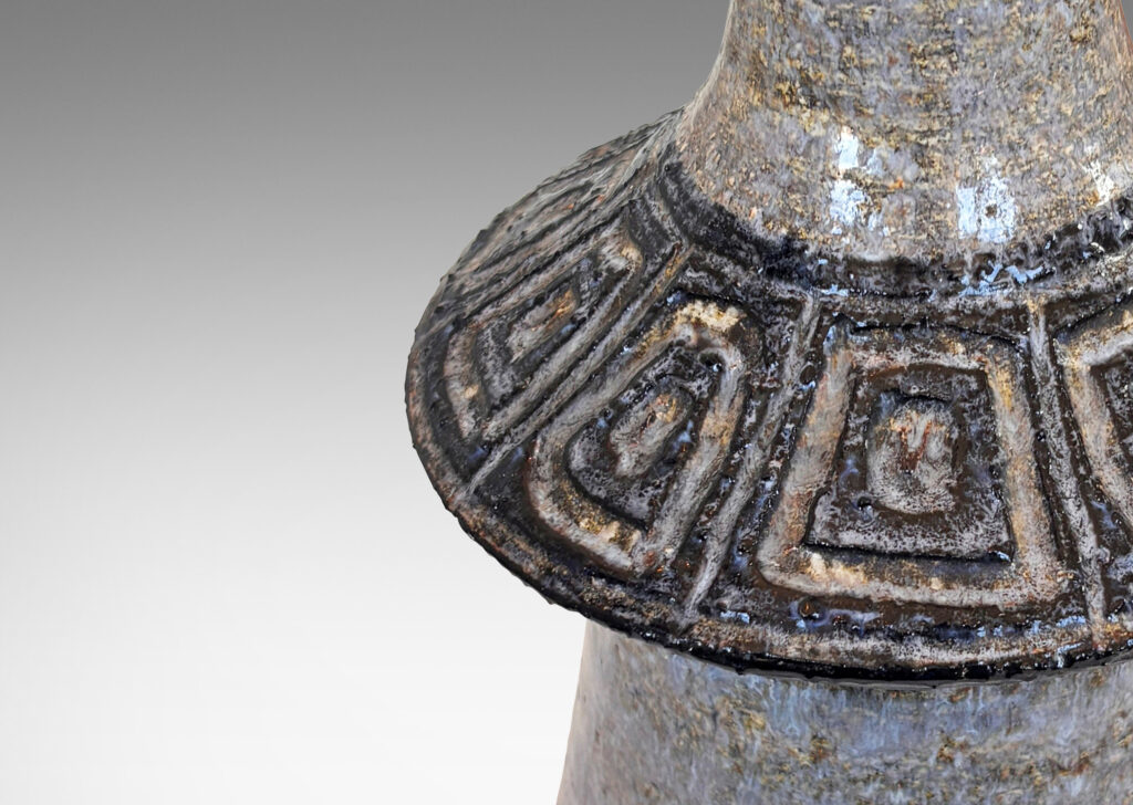 Gallery BAC notched conical form with carved banding and concentric square ornamentation, glazed in pale gray with black