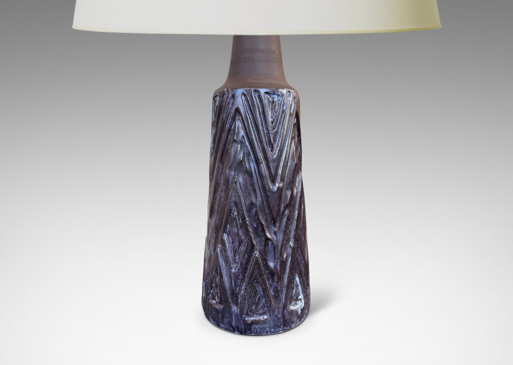Gallery BAC conical form with robust carved lozenge patterning, glazed in eggshell finish dark purple and matte brown