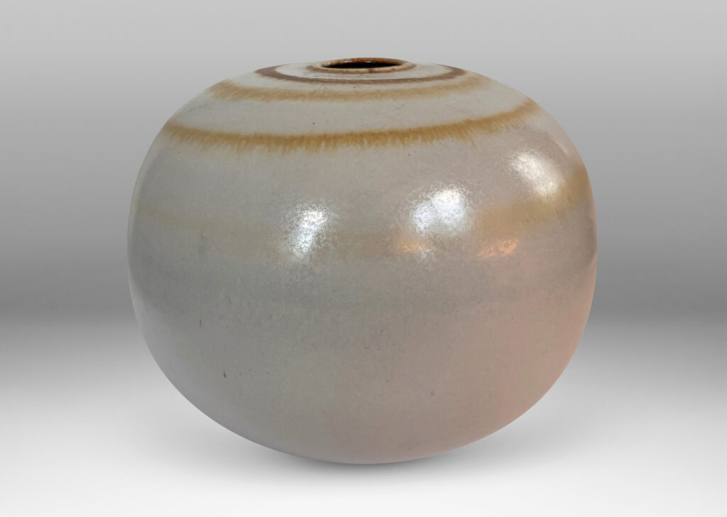 Gallery BAC plump globe form with small mouth, glazed in an eggshell finish pale gray with watery concentric circles in light brown