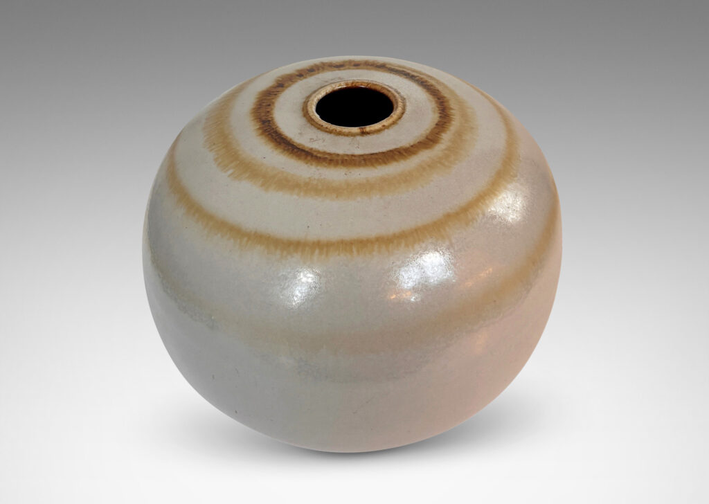 Gallery BAC plump globe form with small mouth, glazed in an eggshell finish pale gray with watery concentric circles in light brown