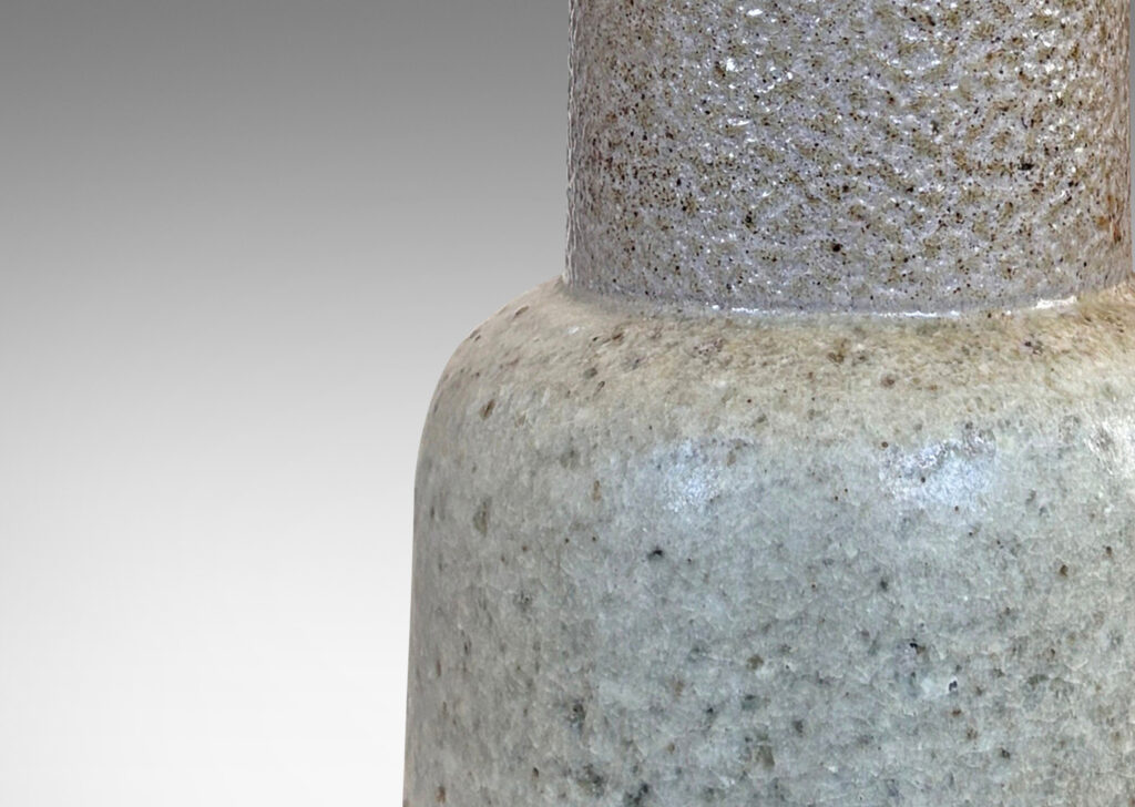 Gallery BAC tiered baluster form, with bell form base and wide neck stand, glazed in mottled medium and pale grays