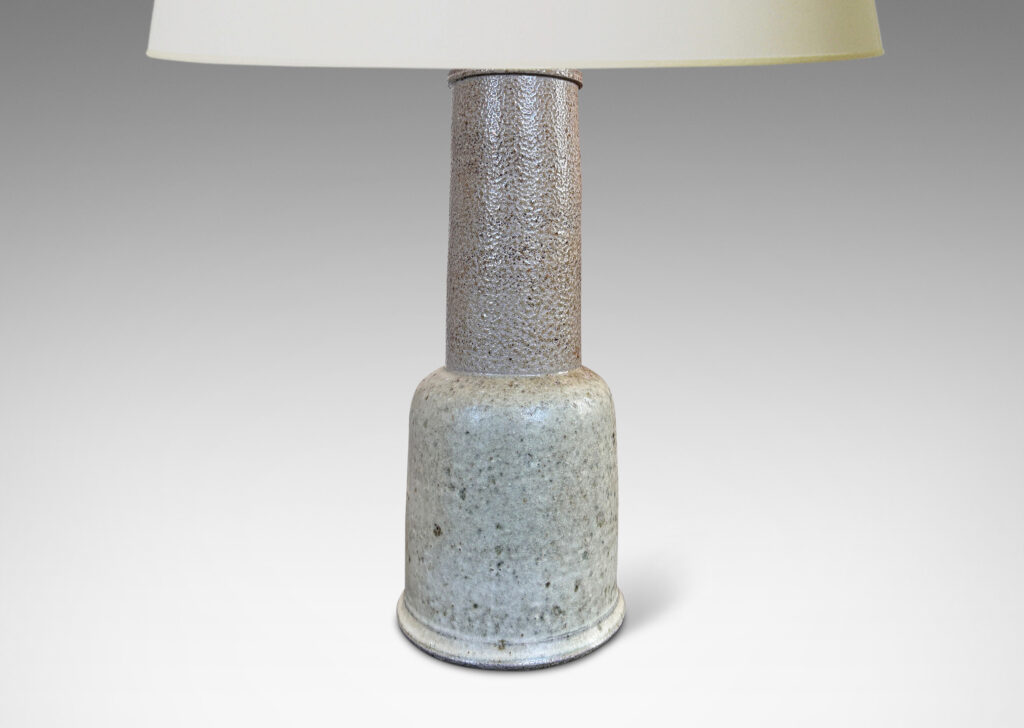 Gallery BAC tiered baluster form, with bell form base and wide neck stand, glazed in mottled medium and pale grays