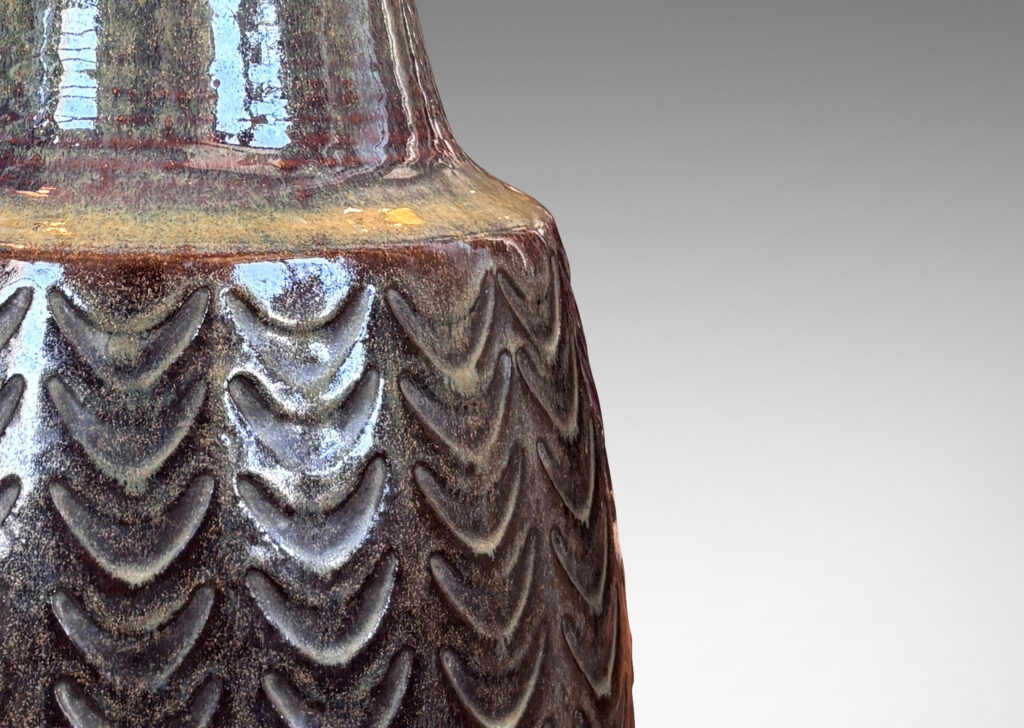 Gallery BAC pawn-like form with swelling body and conical neck, brown-taupe, with carved arc design and lustrous brown and tan glazing