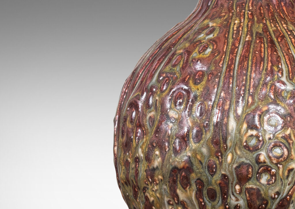 Gallery BAC bulbous form with organic reliefs evoking a seed pod, glazed in a pale taupe-brown