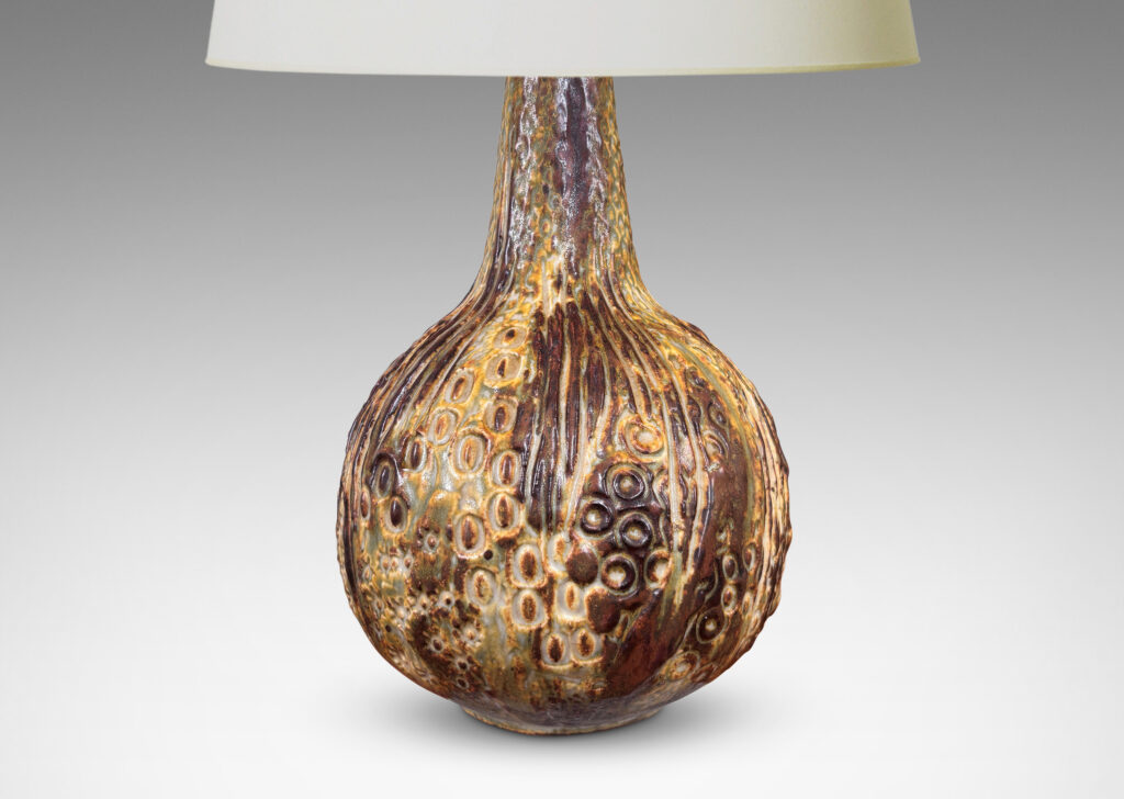 Gallery BAC bulbous form with organic reliefs evoking a seed pod, glazed in a pale taupe-brown