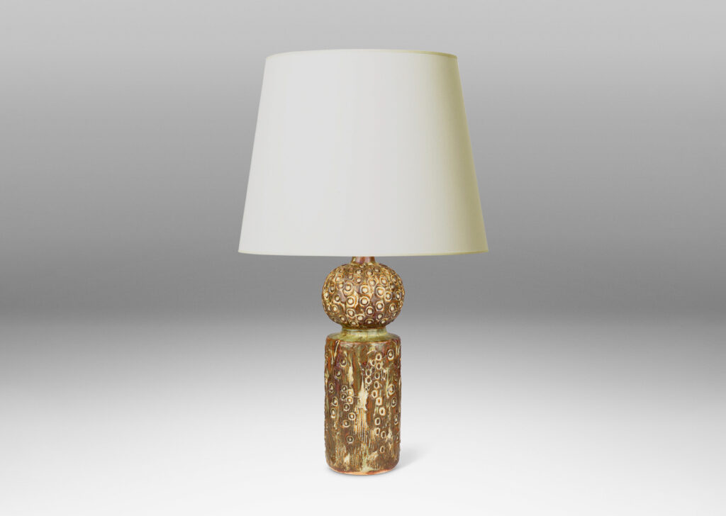 Gallery BAC bulbous cap on a cylindrical base, covered in an organic seed-pod evoking texture