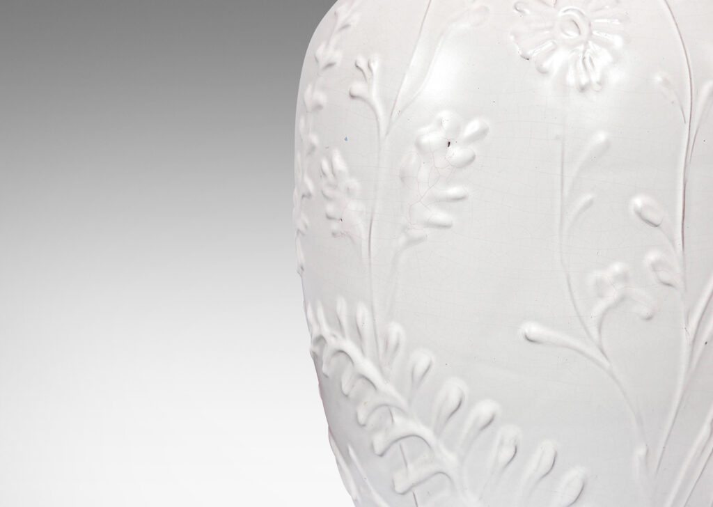 Gallery BACtapered form with slip-sculpted wildflowers in relief