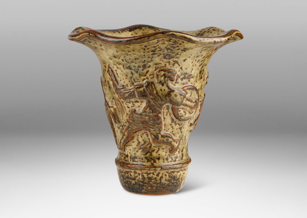 Gallery BAC onical form with undulating lip and relief mythological figures, with a masterful brown and light greige “Sung” glaze