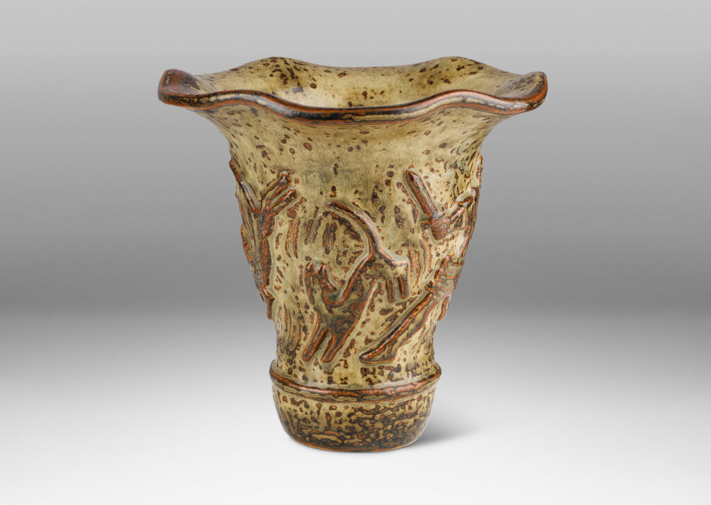 Gallery BAC onical form with undulating lip and relief mythological figures, with a masterful brown and light greige “Sung” glaze