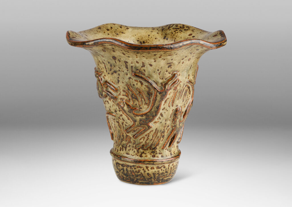 Gallery BAC onical form with undulating lip and relief mythological figures, with a masterful brown and light greige “Sung” glaze