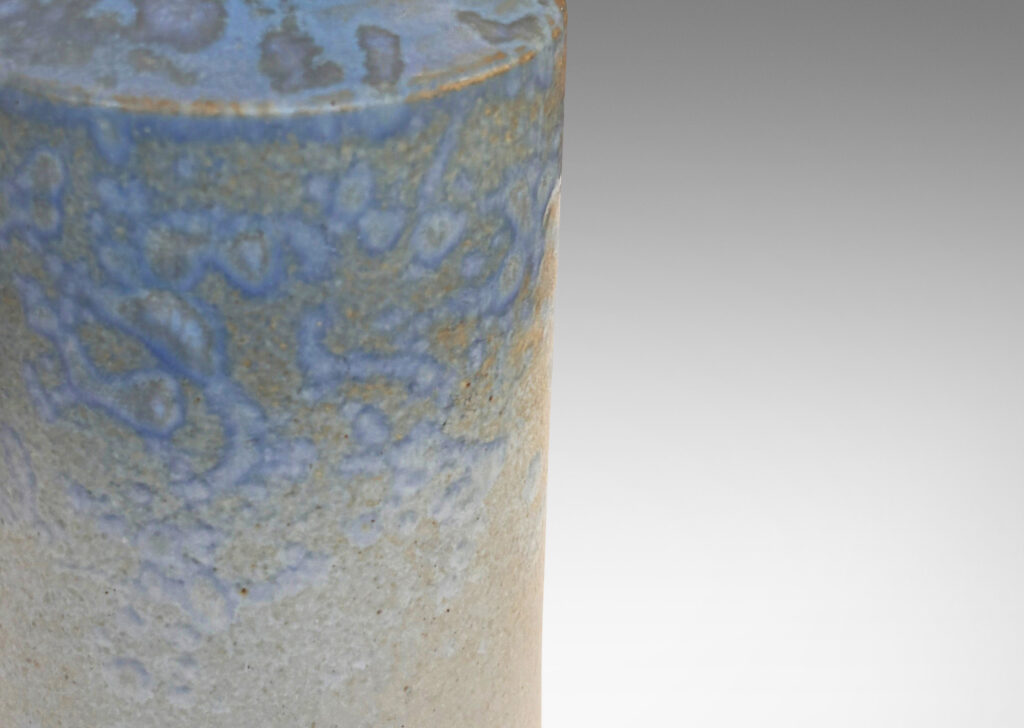 Gallery BAC cylindrical form with sprouting neck, glazed in pale gray with light blue dappling around shoulder