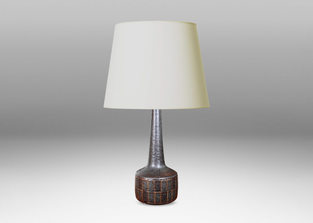 Gallery BAC low drum form with carved grid pattern, tall conical neck, and matte brown glaze