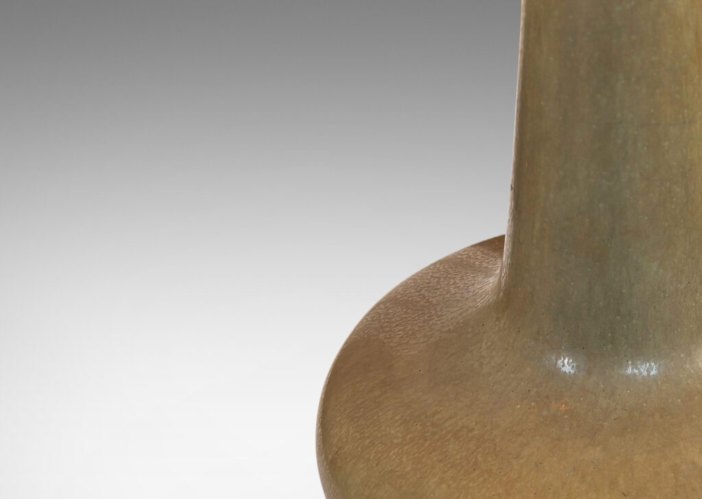 Gallery BAC softly modeled compressed form with tall attenuated neck, glazed in a harefur light olive green with pale blue-green