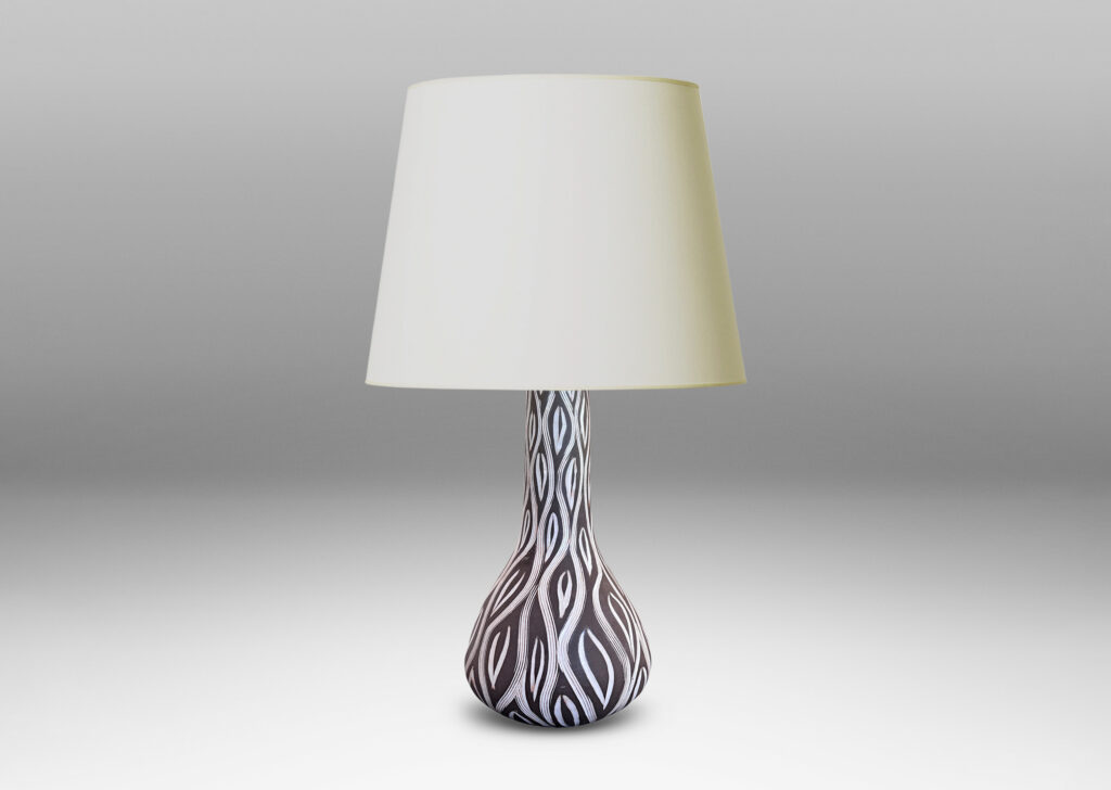 Gallery BAC gourd form with tall neck, glazed in matte brown with carved ogival pattern in semi-gloss white