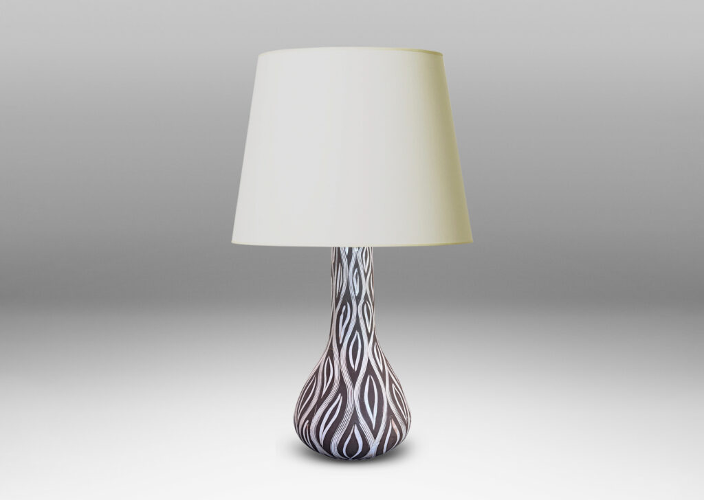 Gallery BAC gourd form with tall neck, glazed in matte brown with carved ogival pattern in semi-gloss white