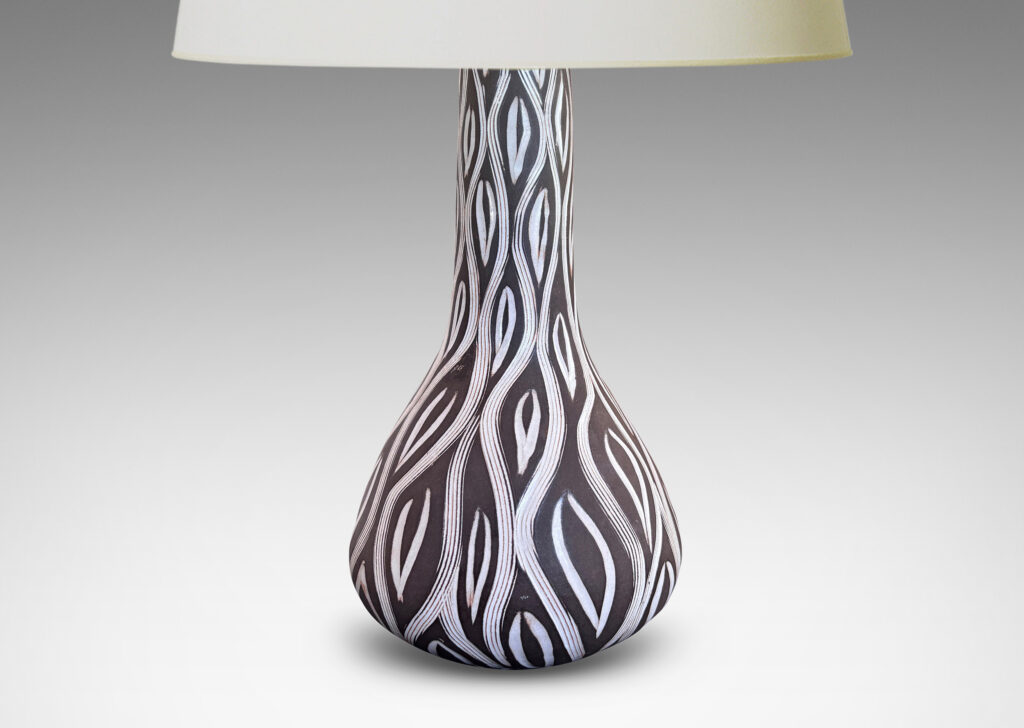 Gallery BAC gourd form with tall neck, glazed in matte brown with carved ogival pattern in semi-gloss white