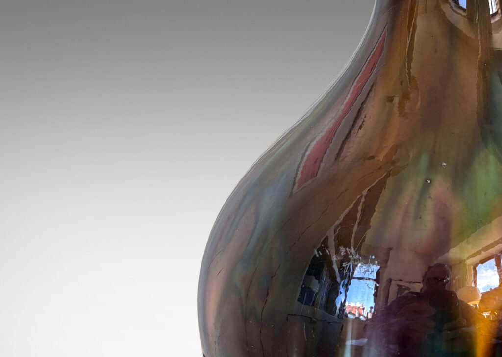 Gallery BAC bulbous form with sprouting neck, glazed in flowing green, brown and purple