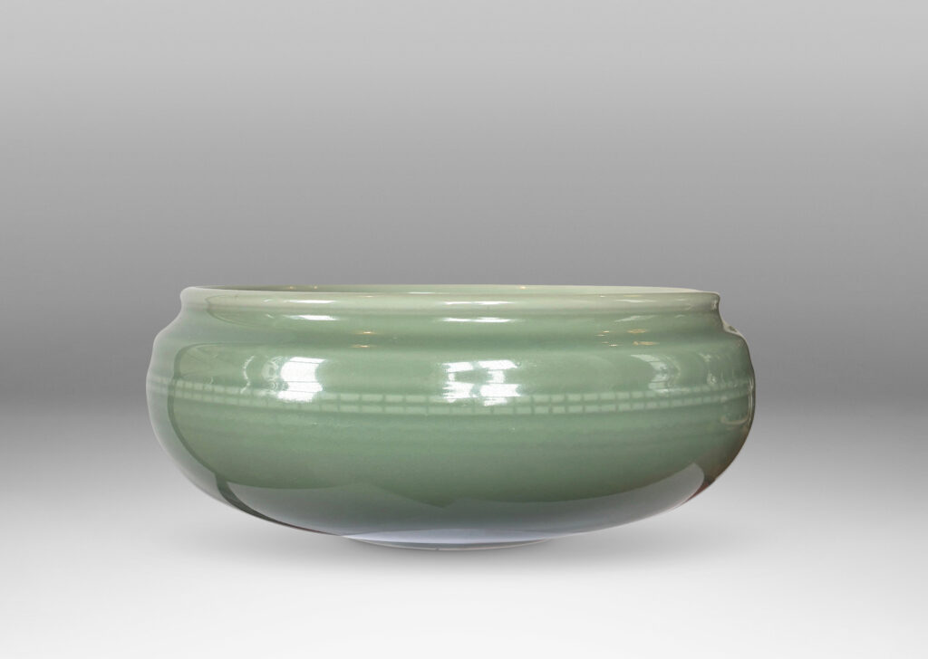 Gallery BAC wide form with sculpted sides, delicately flare lip and relief beaded banding, glazed in an ethereal celadon green
