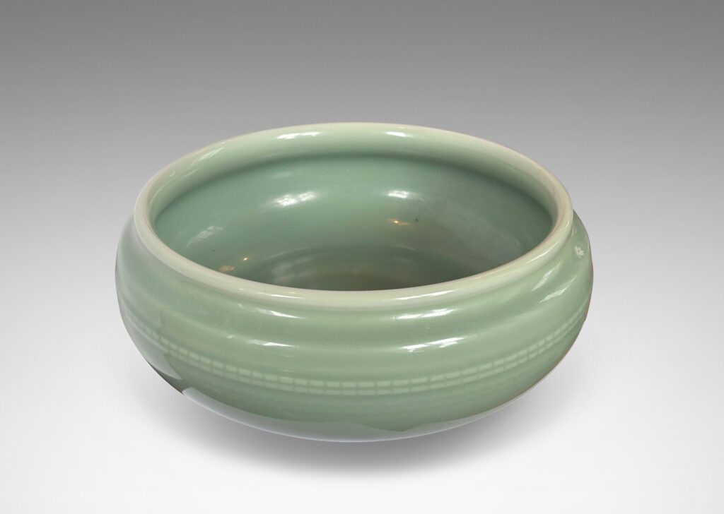 Gallery BAC wide form with sculpted sides, delicately flare lip and relief beaded banding, glazed in an ethereal celadon green