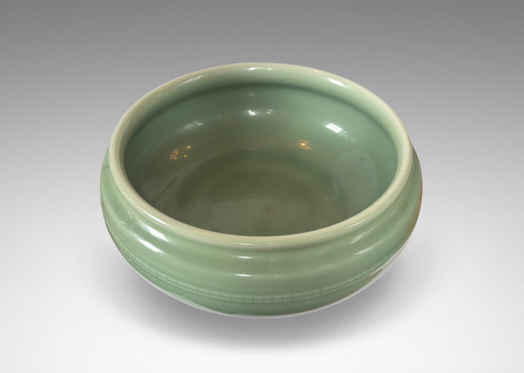 Gallery BAC wide form with sculpted sides, delicately flare lip and relief beaded banding, glazed in an ethereal celadon green