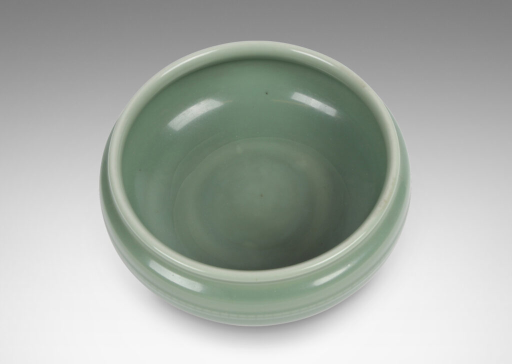 Gallery BAC wide form with sculpted sides, delicately flare lip and relief beaded banding, glazed in an ethereal celadon green