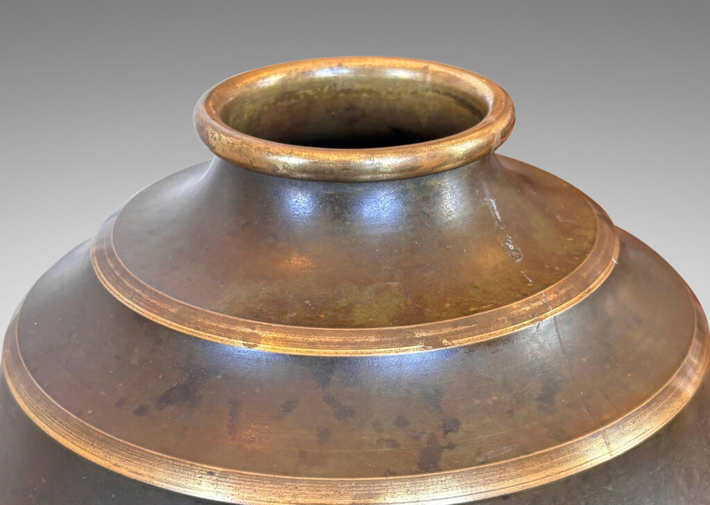 Gallery BAC globe form encircled in sharp lateral flutes, in bronze with verdigris patination and polished accents