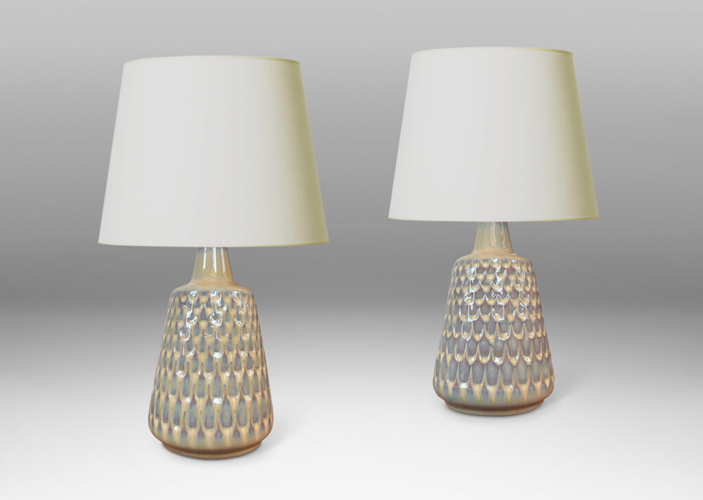 Gallery BAC conical forms with graduated scale pattern in relief, glazed in a light tan tone with pale blue accents