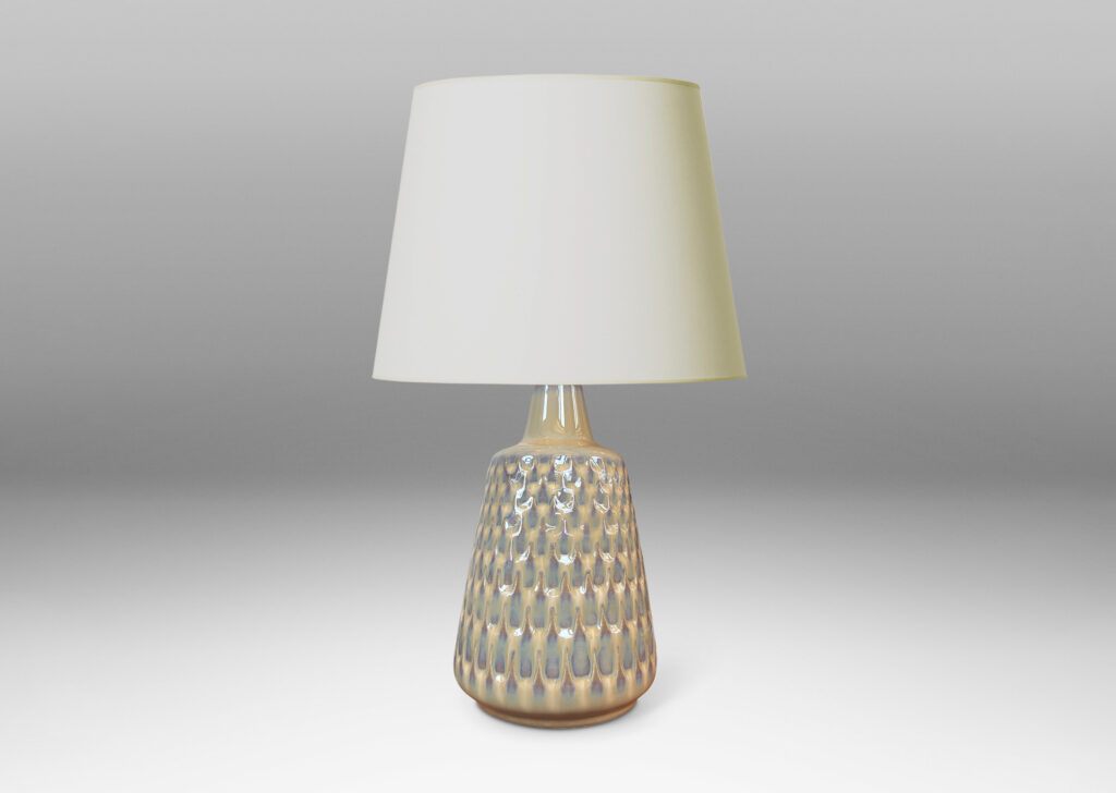 Gallery BAC conical forms with graduated scale pattern in relief, glazed in a light tan tone with pale blue accents