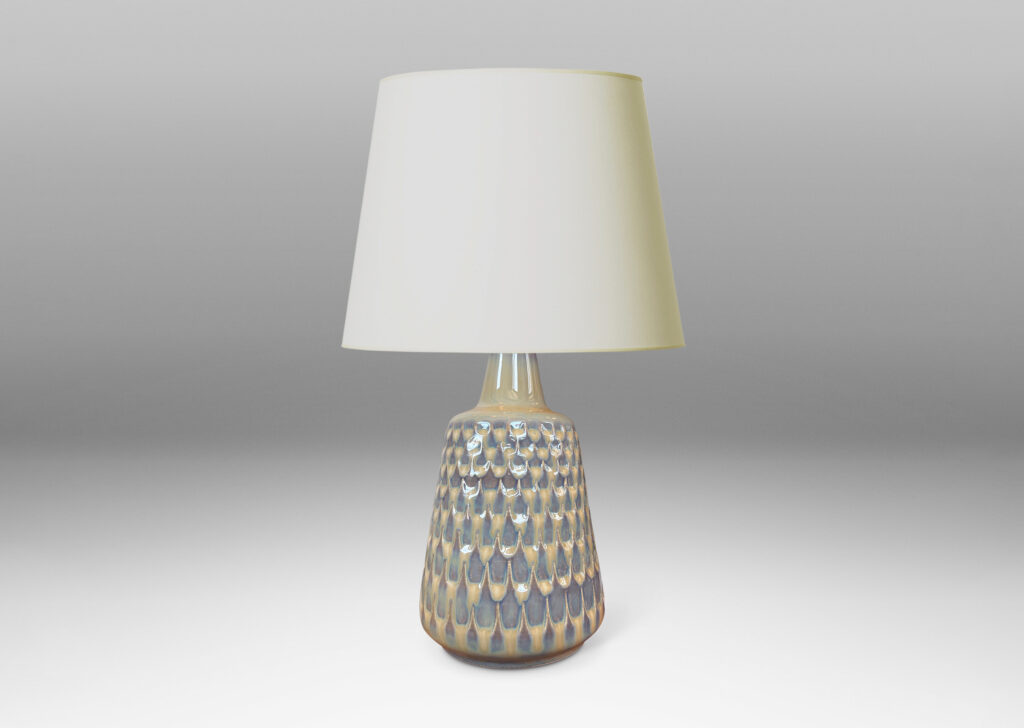 Gallery BAC conical forms with graduated scale pattern in relief, glazed in a light tan tone with pale blue accents
