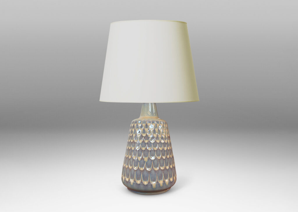 Gallery BAC conical forms with graduated scale pattern in relief, glazed in a light tan tone with pale blue accents