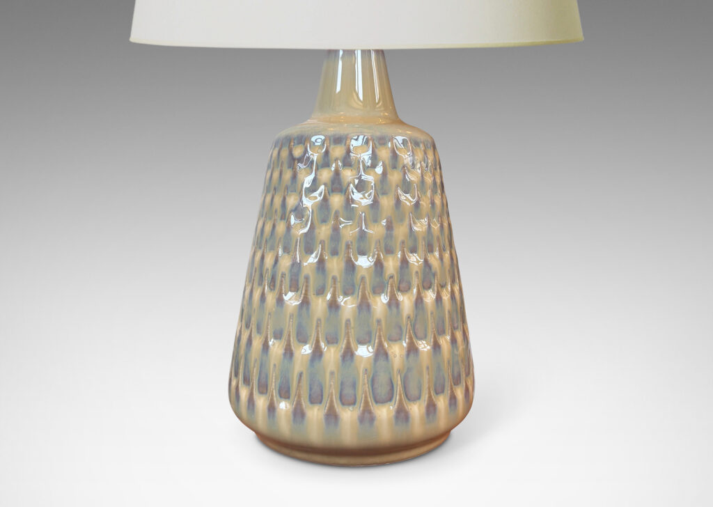 Gallery BAC conical forms with graduated scale pattern in relief, glazed in a light tan tone with pale blue accents
