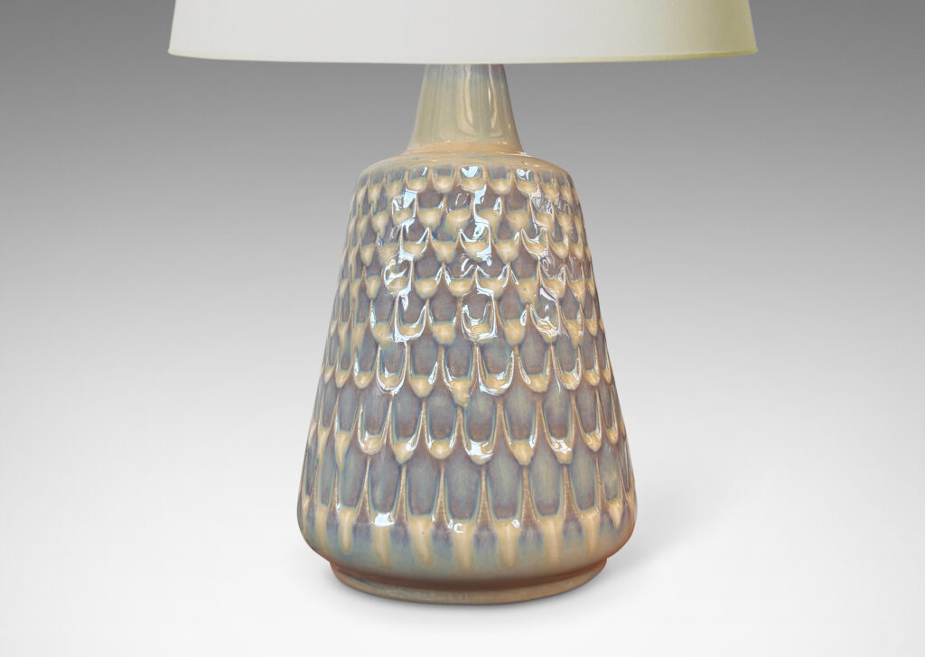Gallery BAC conical forms with graduated scale pattern in relief, glazed in a light tan tone with pale blue accents