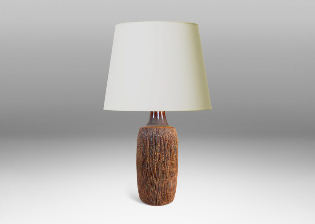 Gallery BAC swelling cylindrical form with a raked texture, glazed in a glossy brown-pale taupe
