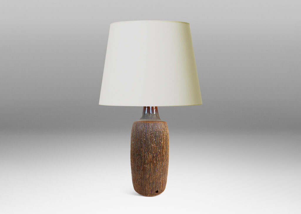 Gallery BAC swelling cylindrical form with a raked texture, glazed in a glossy brown-pale taupe