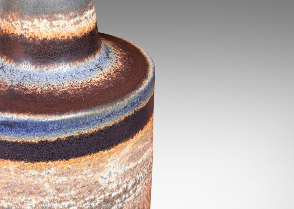 Gallery BAC ovoid cylinder form with conical neck, glazed in medium brown, with dark brown and purple bands