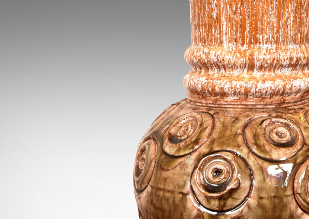 Gallery BAC globe forms with carved concentric circle motifs in shiny olive green glaze, and wide textured necks in partial white glaze