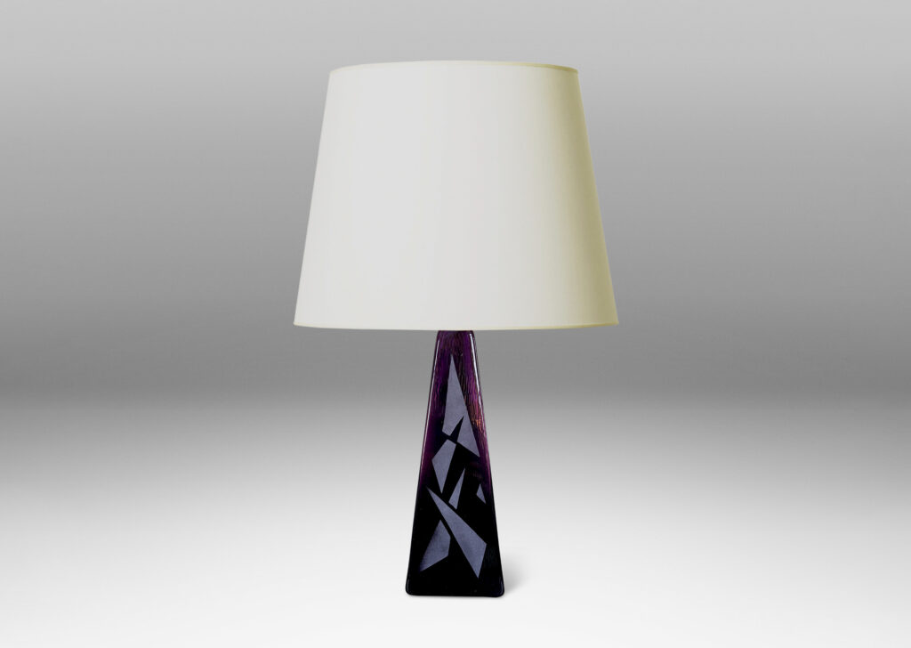 Gallery BAC tall triangular obelisk form in amethyst purple, with a polished finish ornamented with a sandblasted pattern of triangles