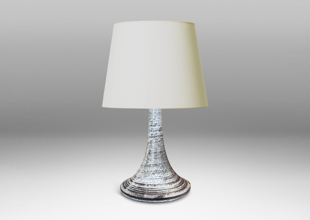 Gallery BAC flared trumpet form, with spiral ridging, glazed in white with black stippling