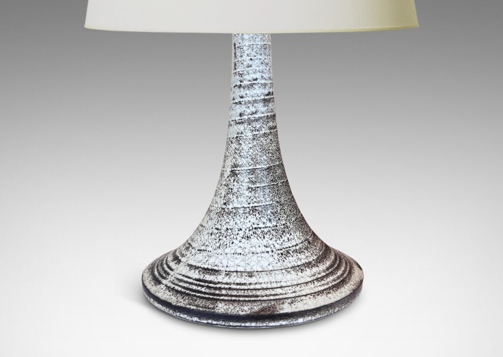 Gallery BAC flared trumpet form, with spiral ridging, glazed in white with black stippling