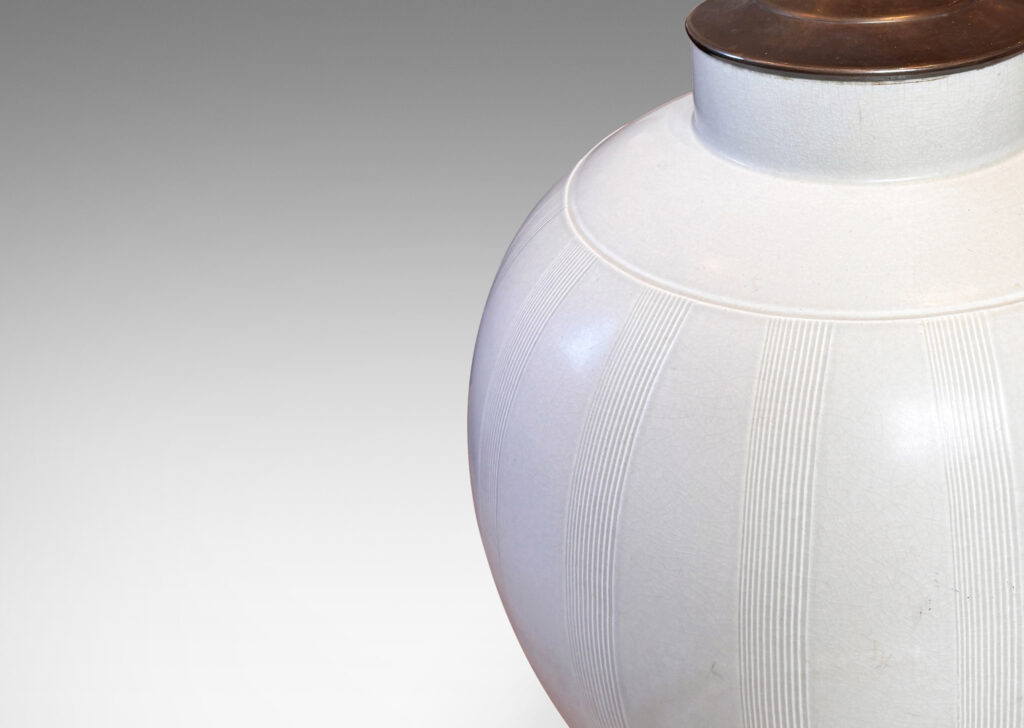 Gallery BAC tapered ovoid form with subtle relief meridian bands, glazed in a soft ivory